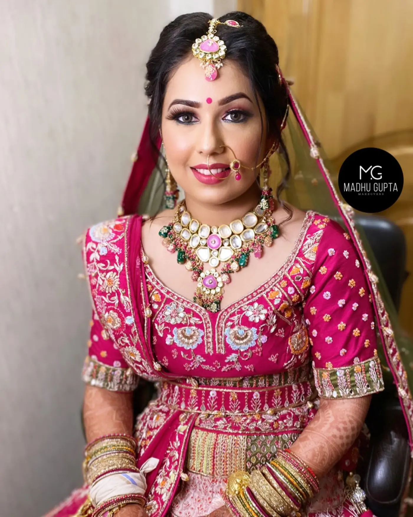 Pink Lehenga, Veil and Mehendi Hands. Bridal makeup by Madhu Gupta at MG Makeovers, Gurugram